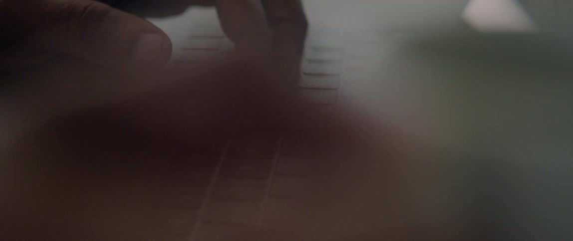 A person is typing on the keyboard