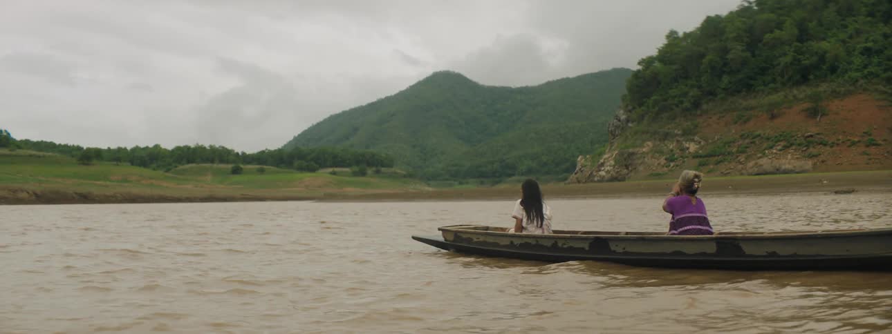 A person is being rowed in the water