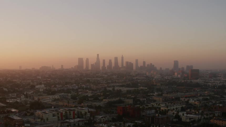 Aerial view of skyscrapers on the city skyline at evening