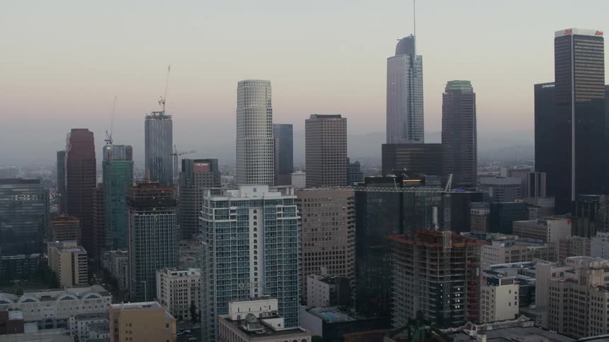Aerial view of skyscrapers on the city skyline at evening