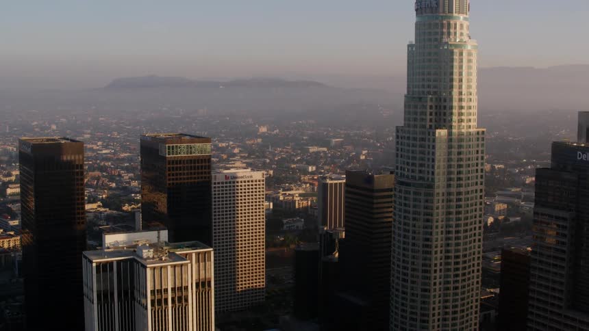 Buildings in a metropolis on a foggy evening