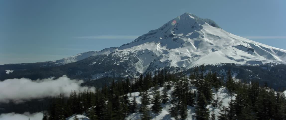 An aerial view of a snowy mountain range