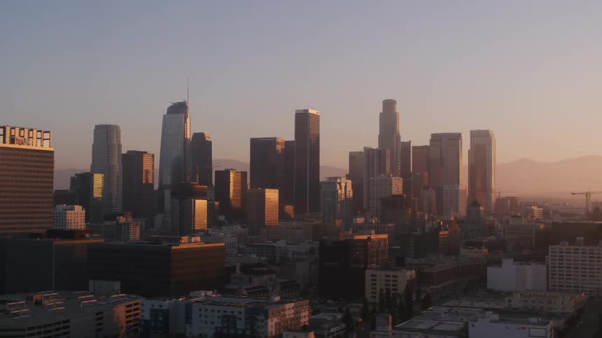 Mountains are seen in the distance from a city