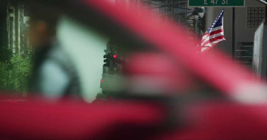 Cars and people on a busy city street