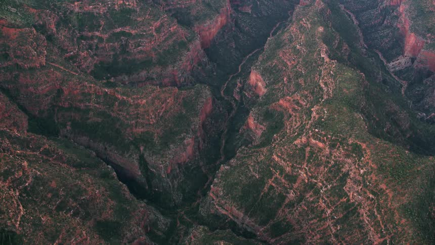 Aerial view looking down deep mountain canyons