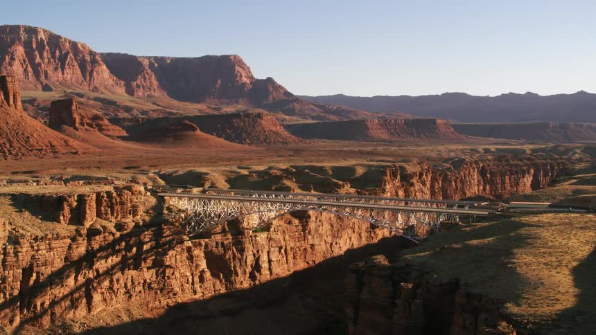 A bridge connects a canyon over a river