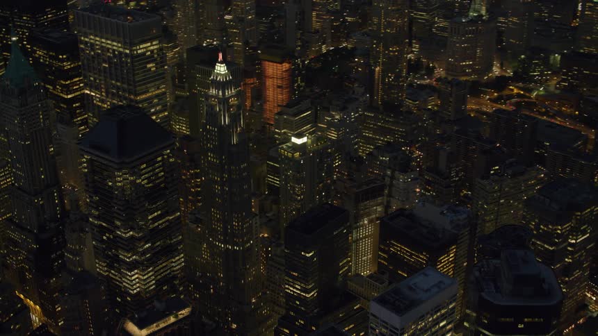New york city skyscrapers and streets illuminated at night