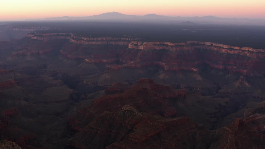 Smoke covers a mountain range and canyon