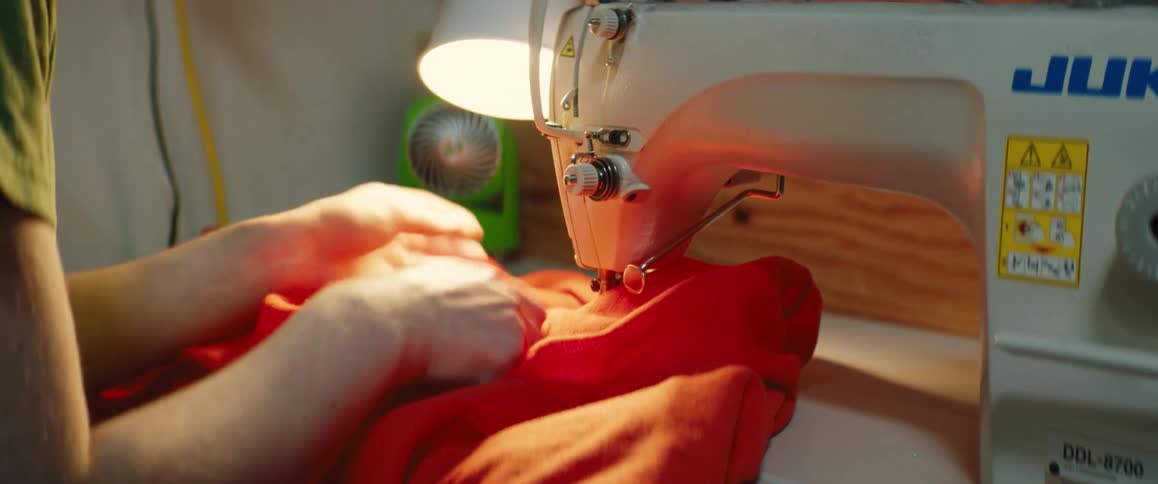 A person is using a sewing machine
