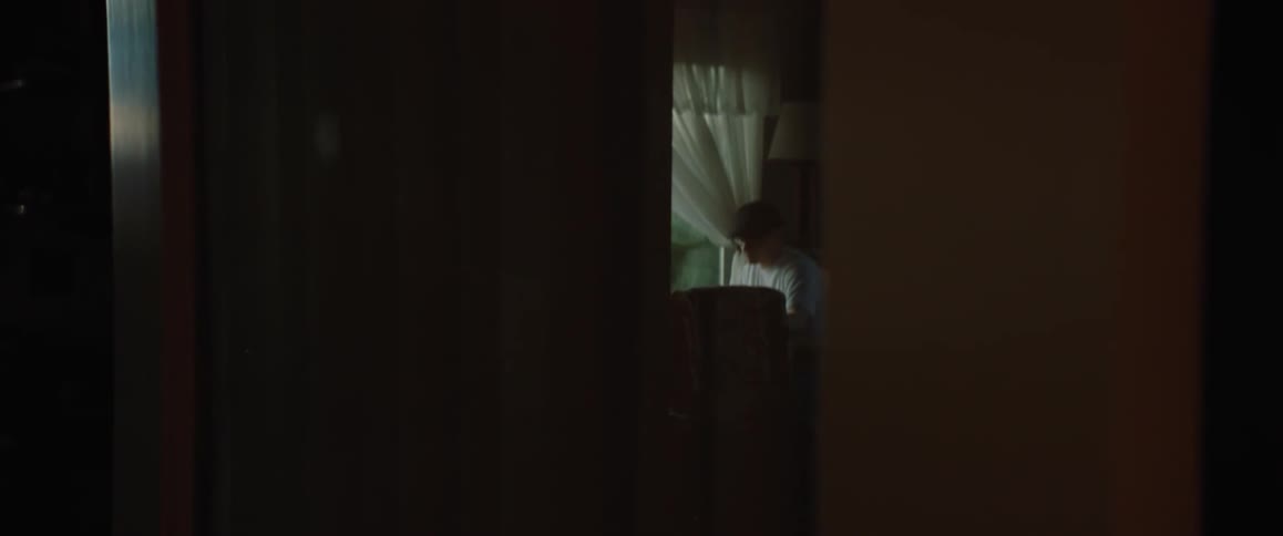 A person is sitting in a room by themselves