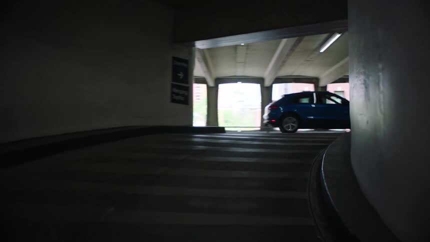 Cars drive in the parking garage