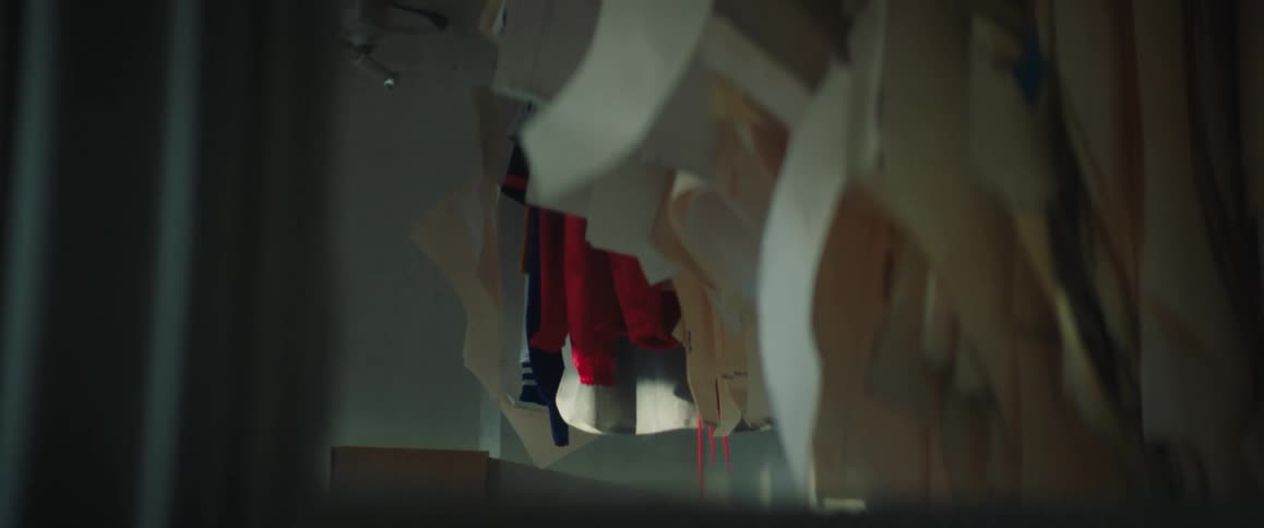 Clothing hangs in a large closet