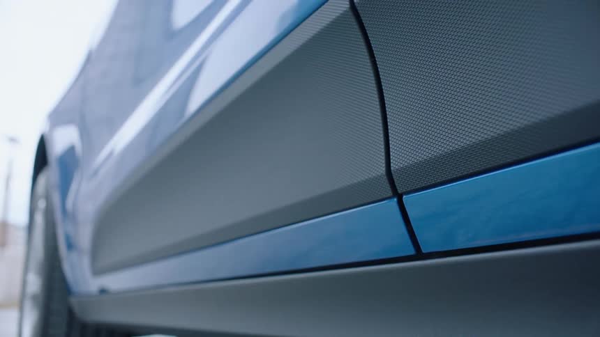 Blue sports car door closes
