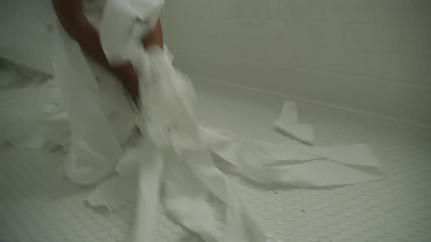 A child running around with toilet paper