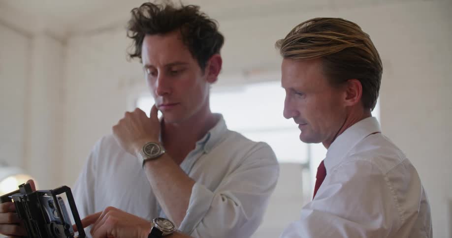 A view of two people looking at a camera
