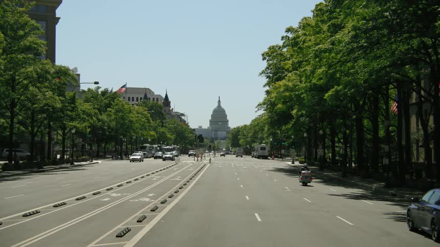 A view of cars driving in a city