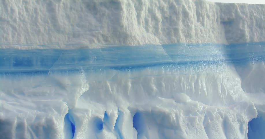 The tall ice wall is white