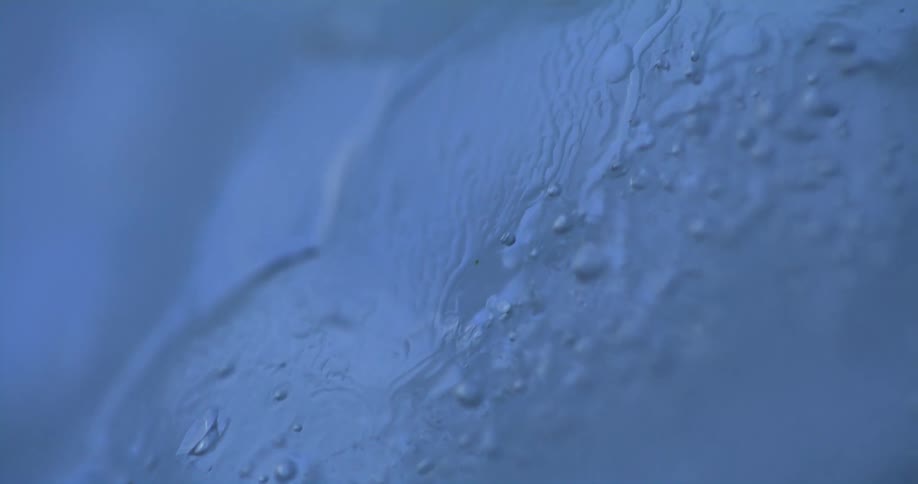 Close up of the textured surface of a blue glass decoration