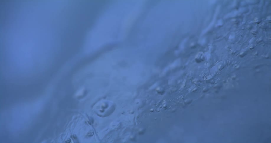 Textured surface of ice has blue shade