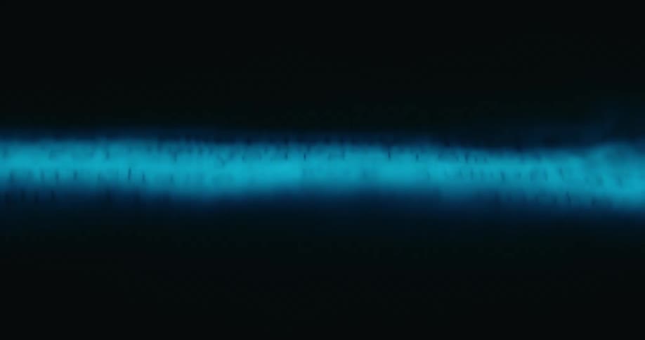 Abstract footage of a a fuzzy light moving on a screen