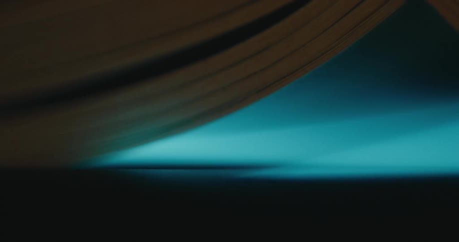 A light from a flatbed scanner can be seen passing in a darkened environment