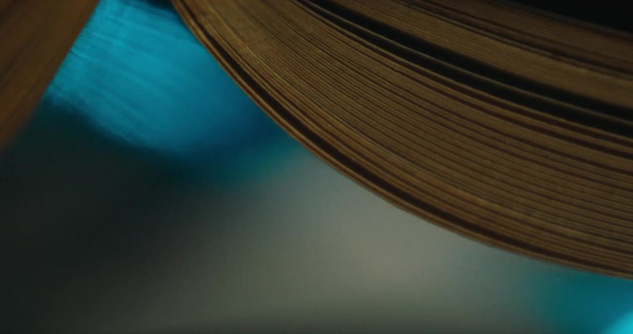 Pages in a book are scanned on a copier