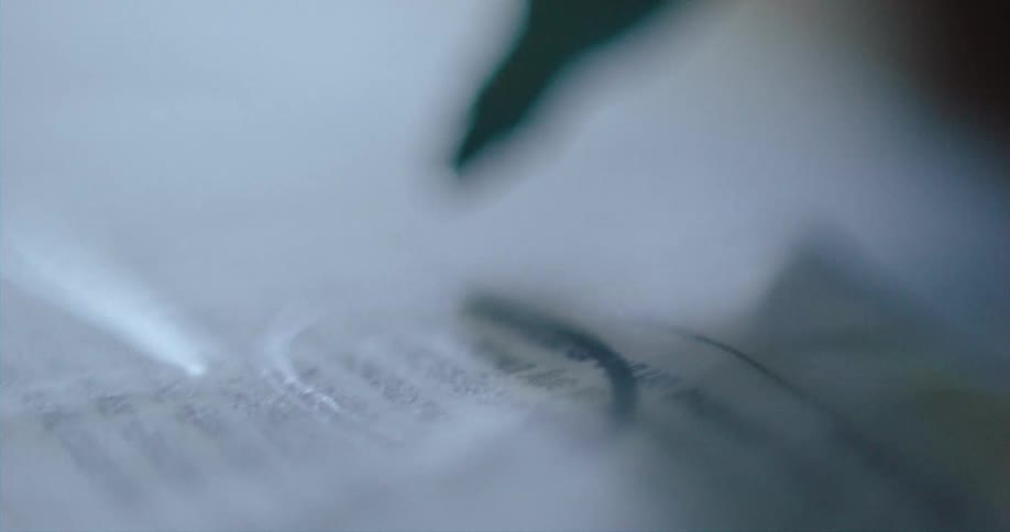 Close up of a felt marker writing on paper