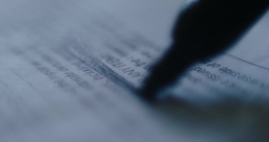Words in document are obscured by black ink