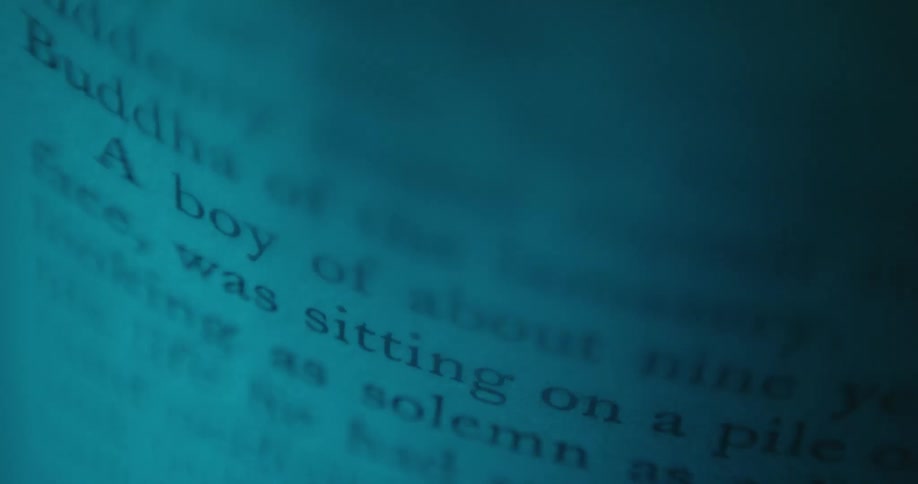 A light moving across text in a book