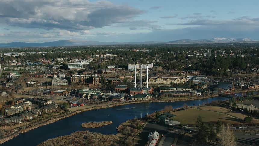 An aerial view of a river running through a city
