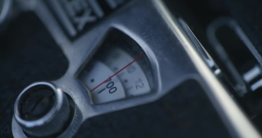 Numbers spin on dials inside a mechanism