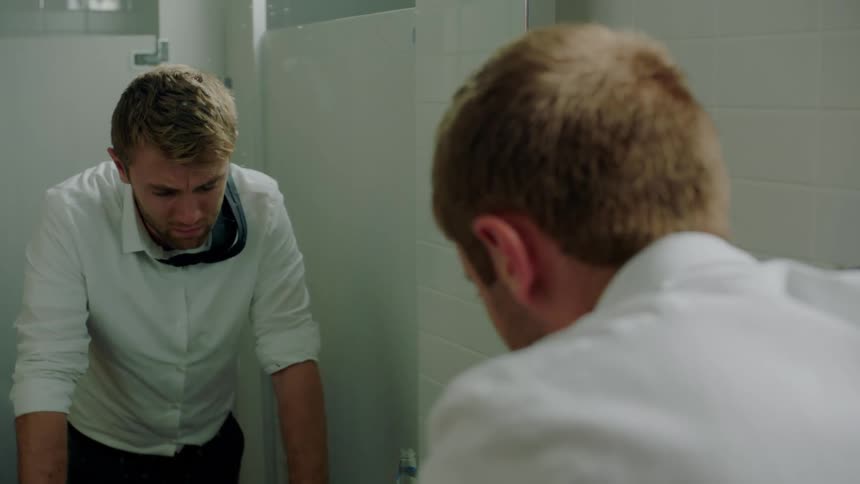 A man standing in a bathroom