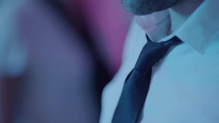 A man is wearing a shirt and tie