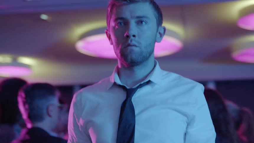 People are standing in a building at a party