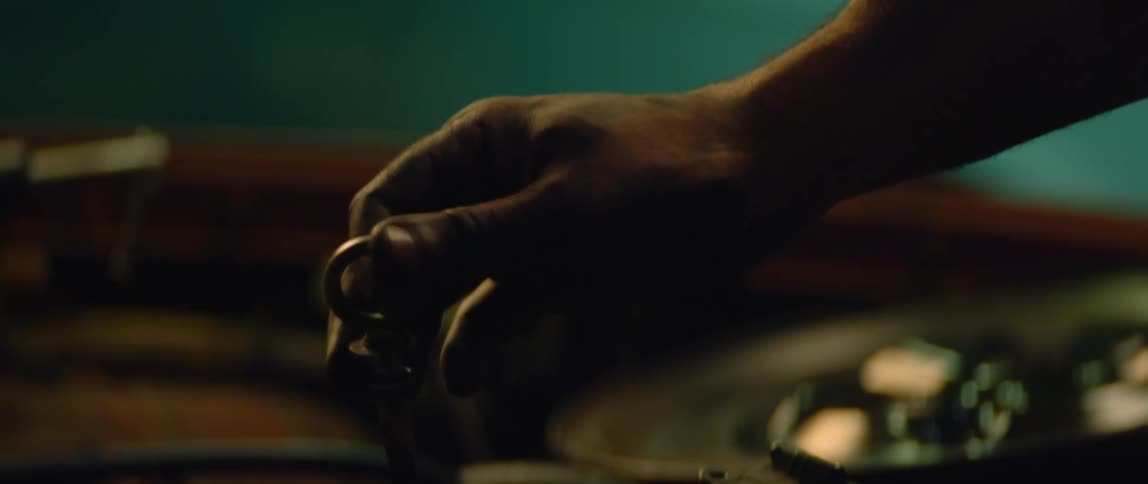 A person is checking the oil in he car