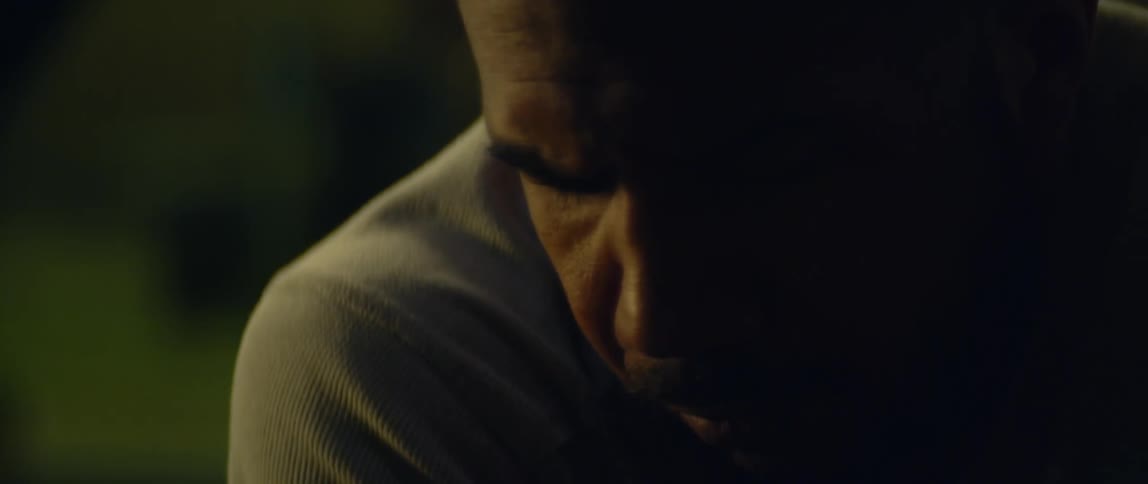 A man looks tired as he looks down