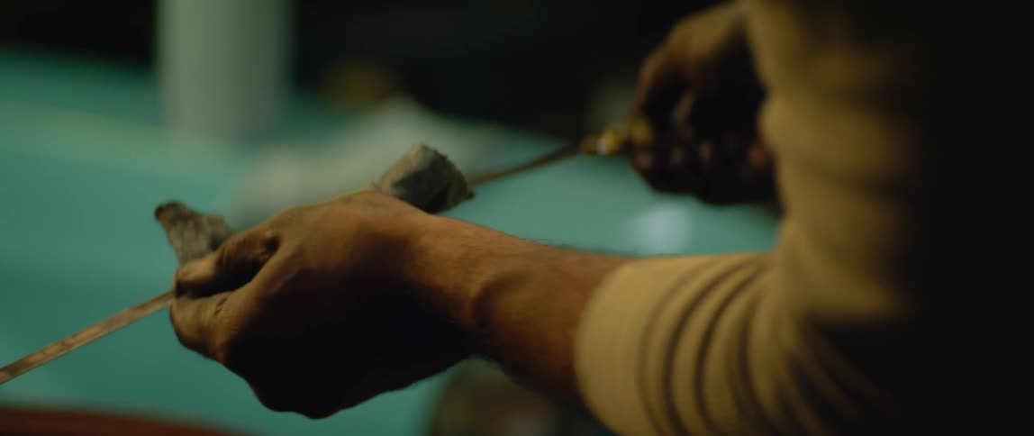 A mechanic checking oil in a car