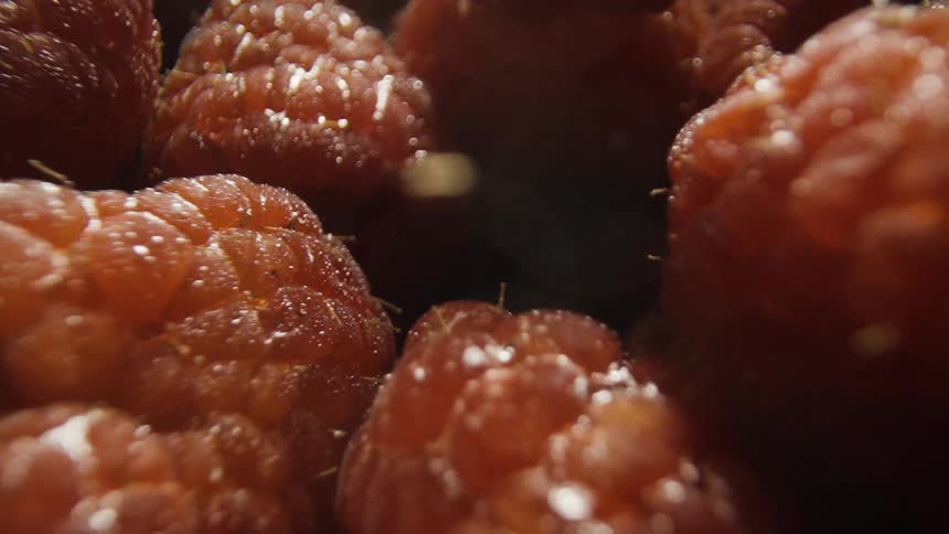 Raspberries floating in liquid