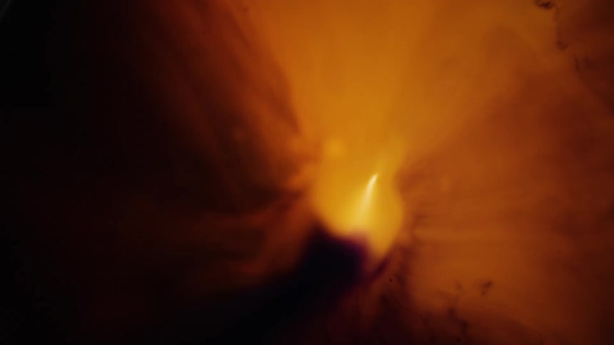 Abstract footage of liquid moving over a bright light
