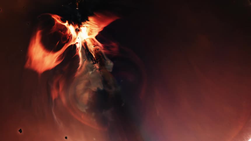 Bright orange flames explode and expand from a white hot center