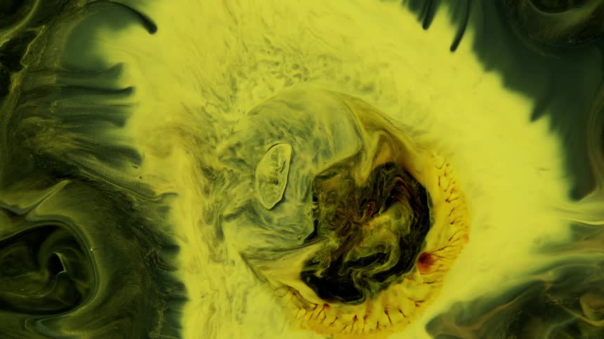 Organic movement is growing as if it were alive inside a yellow object surrounded by green