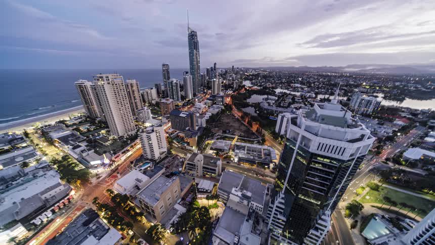 Aerial view of city skyscrapers and high rise buildings next to the beach and ocean