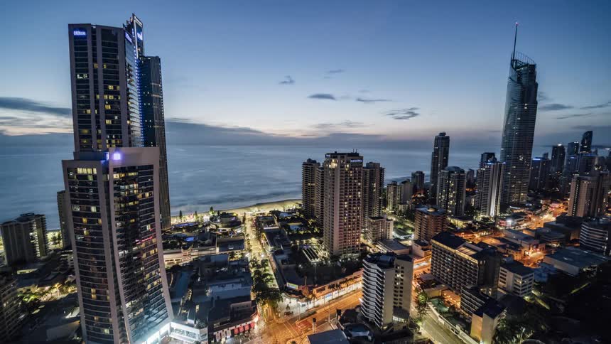 A waterfront city is alive with traffic day and night