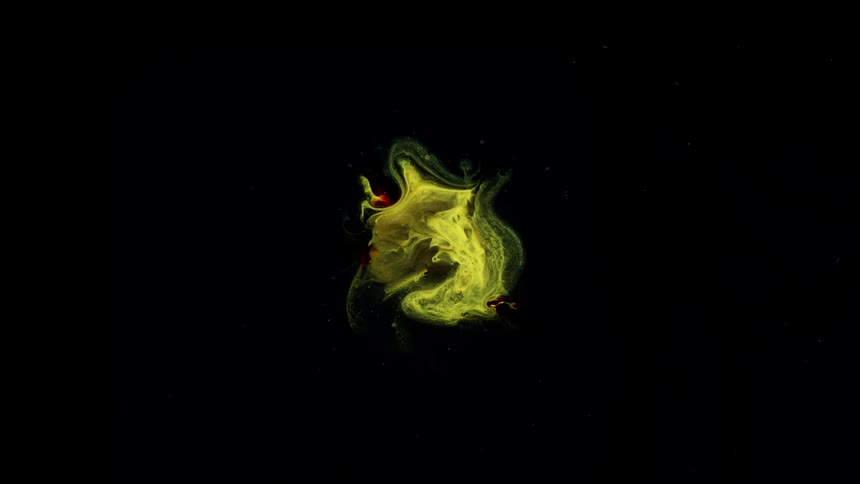 A bright yellow flame slowly expanding and shifting against black