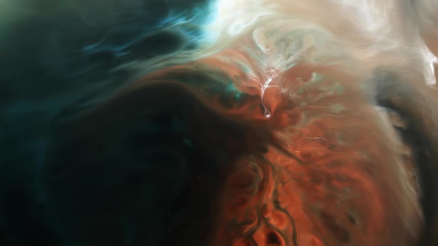 The orange part of a growing organic substance is pushing away the white area as it moves