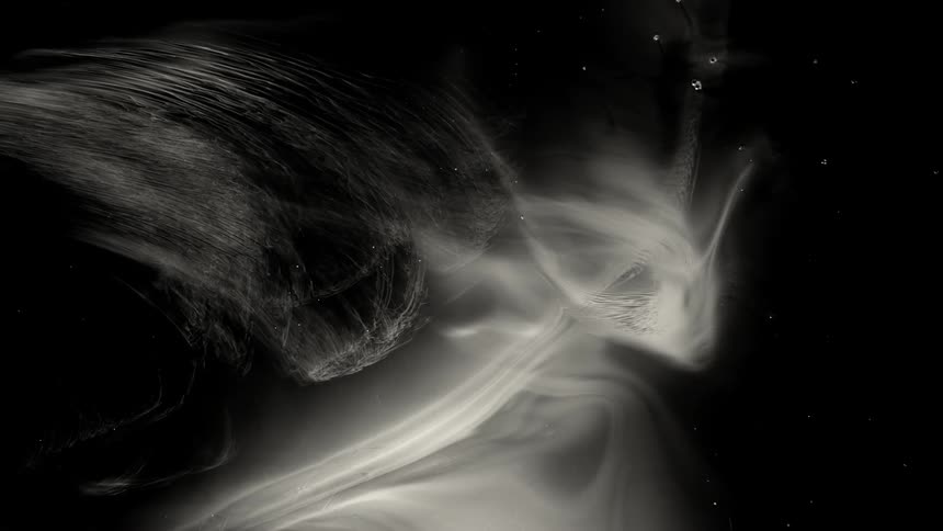 White vapor floats in the night sky
