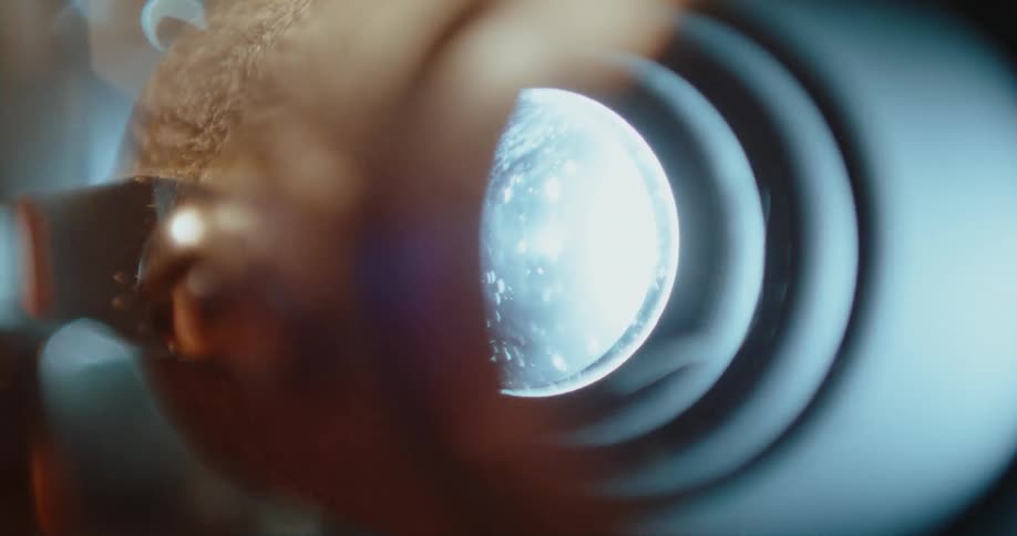 A light glows through a vent up close