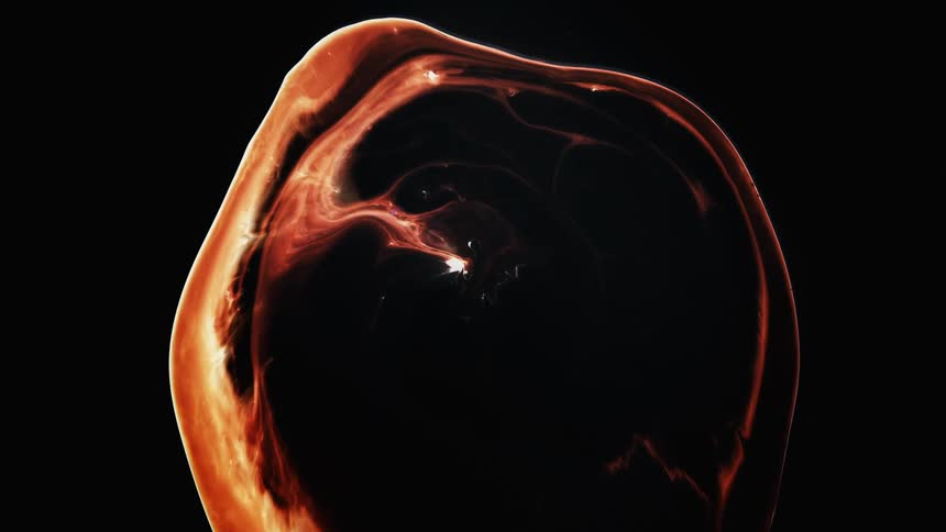 A stream of glowing orange light emerges from inside a dark bubble and encompasses the edges as it grows