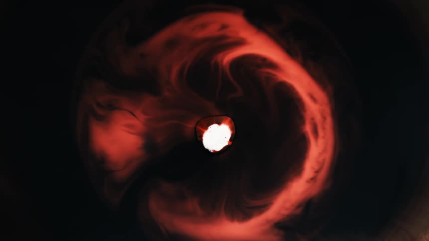Orange flames explode from a white center and expand in a ring