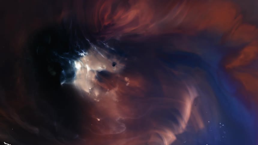 Visual effect of a moving cloud of dark blue and ocher liquid ink flowing in streaks and slow waves